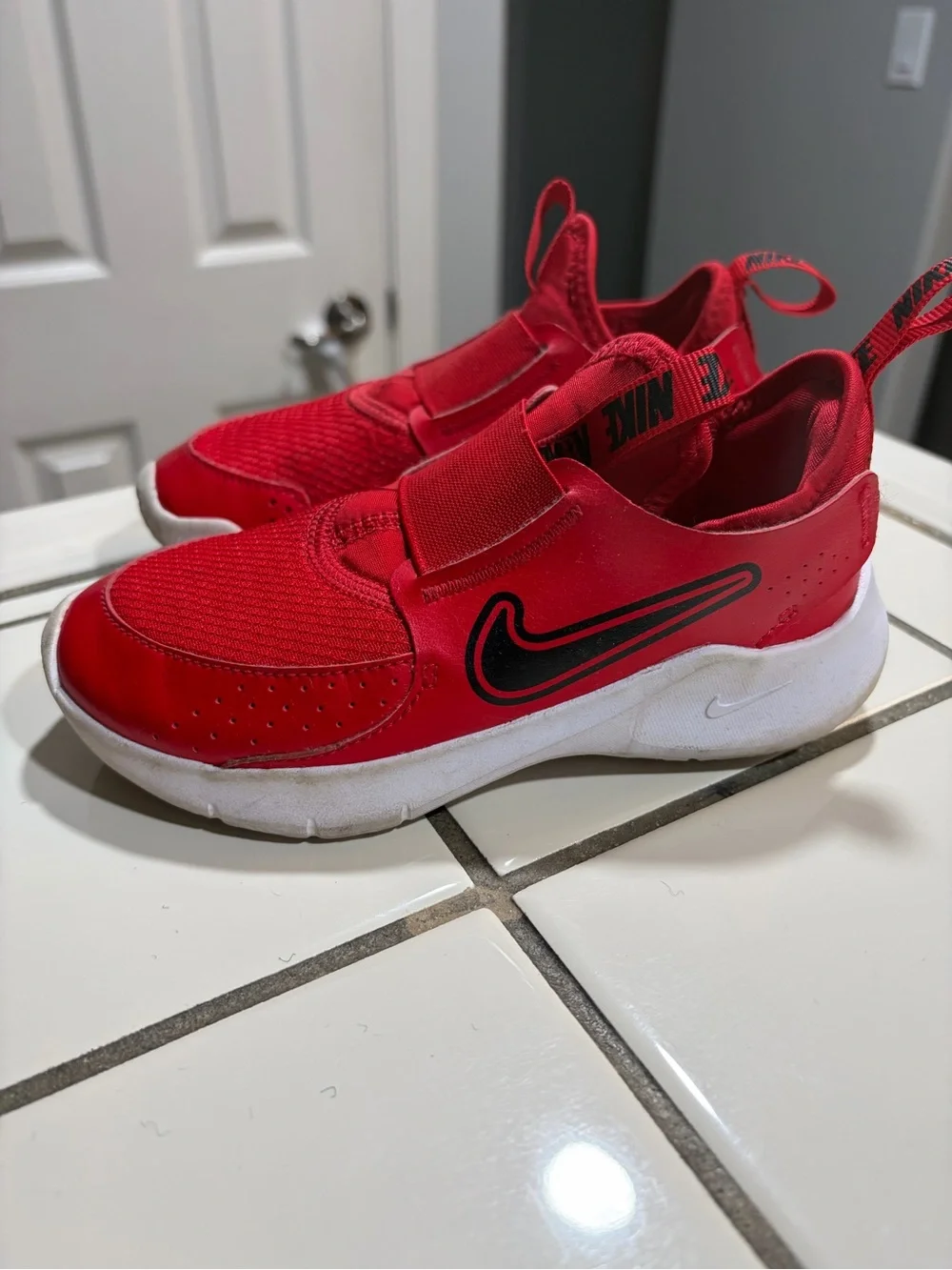 Nike Kids Slip-On Athletic Sneakers in Red and Black